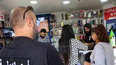 The inspectors from the Ministry of Economy in a shop belonging to a generator owner in Furn el Shebbak, Lebanon. Richard Sammour for The National