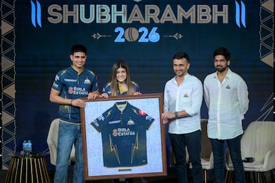 Gujarat Titans captain Shubman Gill unveils the team jersey ahead of IPL 2026. AFP