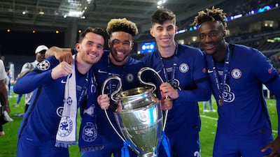 Chelsea's Ben Chilwell, Reece James, Kai Havertz and Tammy Abraham celebrate with the trophy after winning the Champions League in May. Reuters