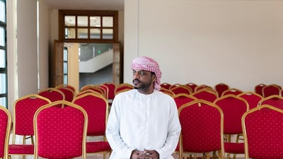 Sulaiman Al Dhanhani, 41, at the ministry to receive the number of his 5-bedroom villa at the new housing community. Reem Mohammed / The National
