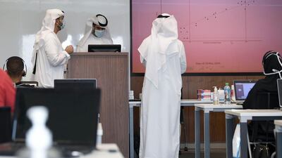 Operators at their desk at Dubai's Covid-19 Command and Control Centre at Mohammed bin Rashid University, in Dubai. AFP
