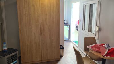 The AC unit runs continuously and there is a fan attached to the wall to keep the room cool