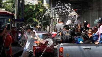 During New Year's festivities in Thailand people celebrate by soaking each other with water.