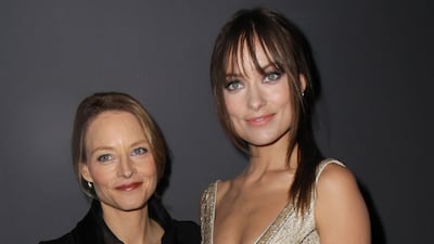 Jodie Foster and Olivia Wilde, in Giorgio Armani, attend the Giorgio Armani Prive show as part of Paris Haute Couture Fashion Week spring / summer 2011 at Espace Vendome on January 24, 2011, in Paris, France.