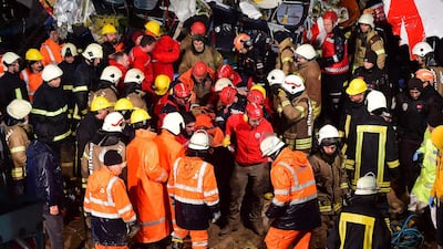Rescuers carry a person extracted from the crash of a Pegasus Airlines Boeing 737 airplane, after it skidded off the runway upon landing at Sabiha Gokcen airport in Istanbul. AFP