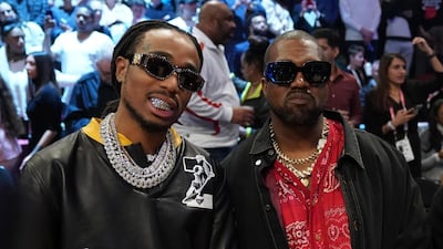 Quavo and Kanye West watch the action.Kyle Terada-USA TODAY