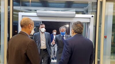IAEA chief, Rafael Grossi, second right, is welcomed by deputy head of Iran's Atomic Energy Organisation, Behrouz Kamalvandi, right, as he is accompanied by Iran's envoy to the IAEA, Kazem Gharibabadi, second left. AP