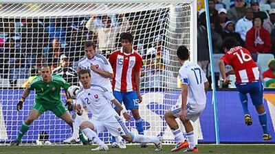 Cristian Riveros of Paraguay, right, lashes home his side's second goal against Slovakia.