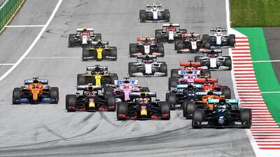 Mercedes' Valtteri Bottas leads Red Bull's Max Verstappen during the first lap of the race.