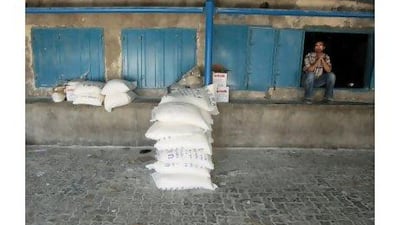 A Palestinian man sits at a United Nations food distribution centre at Shati refugee camp in Gaza City yesterday. Ismail Zaydah / Reuters