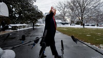 President Donald Trump walks off after speaking with reporters on the South Lawn of the White House. AP