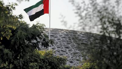 The UAE flag at the Louvre Abu Dhabi. ADQ has signed a definitive agreement to acquire Egypt’s Amoun Pharmaceutical Company. Victor Besa / The National