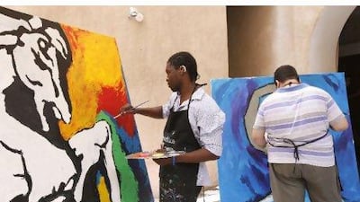 From the left, Victor Sitali, 21 , from Zambia, and Zaid Jaffar, 28, from Iraq, finish their tributes to MF Husain yesterday.