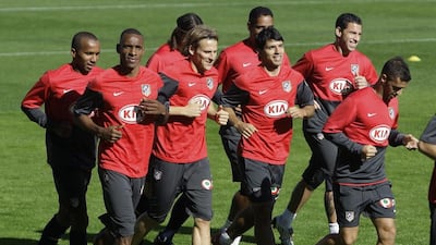 Diego Forlan, third from left, shown here with Atletico Madrid, learnt the importance of training while playing with other dedicated stars in the game. (AP Photo/Paul White)
