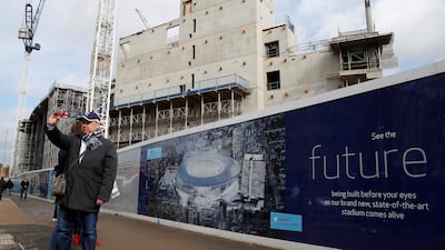 A man takes a selfie in front of construction work at White Hart Lane. Tottenham Hotspur are expected to return to the stadium in time for the 2018/19 season. Reuters