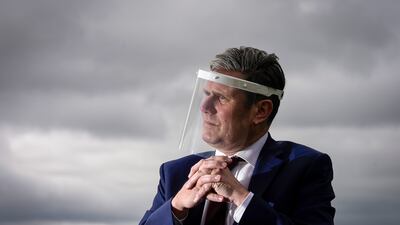 Mr Starmer in talks with care home workers and family members of residents at Cafe 1899 in Gedling Country Park during the Covid-19 pandemic in July 2020. Getty Images