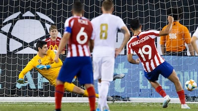 Costa sends Real Madrid goalkeeper Thibaut Courtois the wrong way with his penalty. EPA