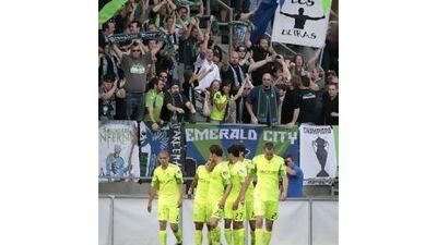 The Seattle Sounders supporters have adopted an almost English Premier League approach to singing, chanting and hardly endearing themselves to ordinary citizens. Elaine Thompson / AP Photo