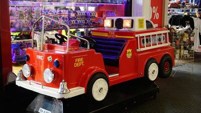 A children’s fire truck ride takes old one-pound coins. The introduction of the 12-sided coin comes amid concerns about the 30-year old coin’s vulnerability to counterfeiting. Bethany Clarke / Getty Images