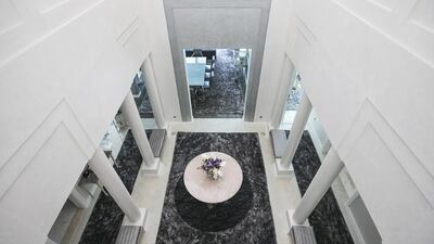 The entrance foyer. Having been completely stripped down and rebuilt over a two-year construction period, the seller, a British national who currently lives in Monaco, has set about rebuilding and furnishing this villa with the latest technology and the most opulent fixtures and fittings possible. Mona Al Marzooqi / The National