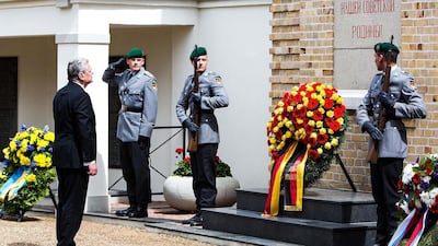 German president Joachim Gauck stands in front of a wreath at a memorial to Soviet Red Army soldiers killed during World War II to commemorate the 70th anniversary of the end of the war on May 8, 2015 in Lebus, Germany. Carsten Koall/Getty Images