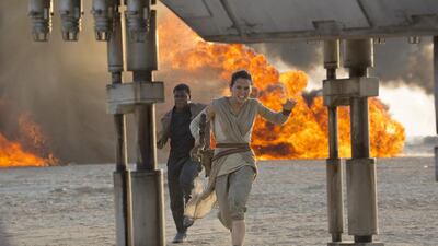 Daisy Ridley, right, as Rey, and John Boyega as Finn, in a scene from Star Wars: Episode VII — The Force Awakens. David James / Disney / Lucasfilm via AP