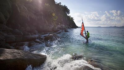 A guest tries out windsurfing at the The Four Seasons Seychelles hotel, which is located on Mahe, the largest of the 115 islands that comprises the Republic of Seychelles. Silvia Razgova / The National