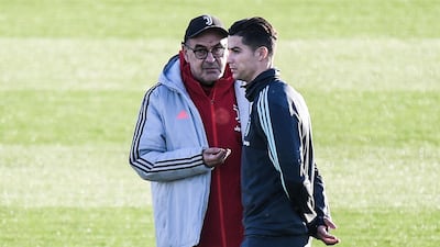 Juventus' coach Maurizio Sarri (L) talks to Portuguese forward Cristiano Ronaldo during a training session at the Continassa Training Ground in Turin. AFP