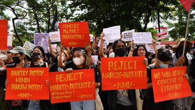 Demonstrators rally in front of the Commission on Elections offices. AFP