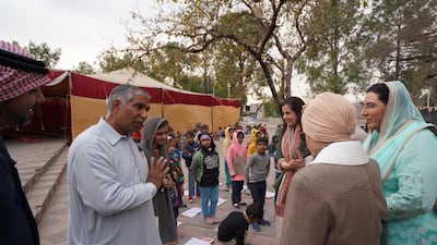 Sheikha Jawaher and her delegation meet firefighter Mohammad Ayub Khan, who since 1982 has taught poor children school lessons for free at a public park in Islamabad in his spare time. More than 20 million children aged 5-16 in Pakistan are out of school. Wam