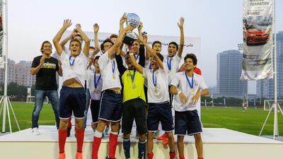 LFIGP boys U16s celebrate their tournament victory in an action packed day for young footballers. Victor Besa for The National