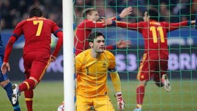 Spain's players celebrate after Pedro's winning goal beat France goalkeeper Hugo Lloris.