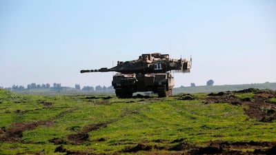 An Israeli tank holds position in the Israeli-annexed Golan Heights. AFP