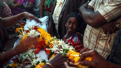 Relatives of Raja Ludraswami Harjan, who died after consuming toxic homemade liquor, mourn at the residence before his funeral in Mumbai, India, on June 20, 2015. Divyakant Solanki/EPA