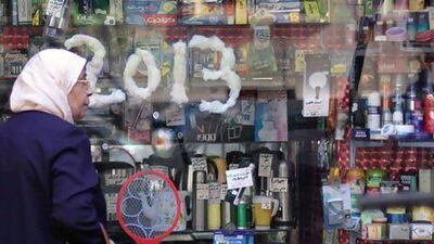 A woman walks past a shop in downtown Cairo. Unilever bucked a trend by posting double-digit growth across the Mena region. Khalil Hamra / AP Photo