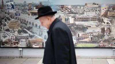 A Jewish man passes a mural of the Mutual Association Israelita Argentina (AMIA), in Buenos Aires, Argentina, 21 January 2020. The Jewish community of Argentina, the largest in Latin America and one of the most numerous in the world, carries multiple scars. Juan Ignacio Roncoroni / EPA