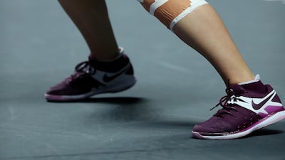 The heavilly strapped left knee of Bianca Andreescu. Getty