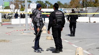 Members of security forces stand guard at the site of a suicide attack near the US embassy in Tunis. Reuters