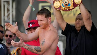 Saul Alvarez applauds the crowd during the weigh-in for his fight against Dmitry Bivol. AP