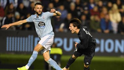 Celta Vigo's David Junca concedes a penalty against Real Madrid's Alvaro Odriozola. Reuters