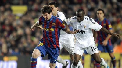 Lasanna Diarra, right, challenging Lionel Messi in a match with Real Madrid in 2009. Pierre-Philippe Marcou / AFP
