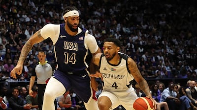 Carlik Jones of South Sudan dribbles past Anthony Davis of USA. Getty Images
