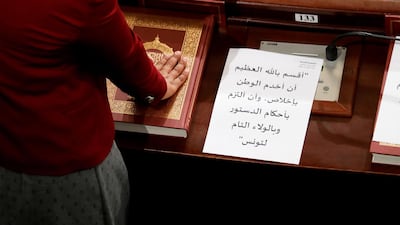 A newly-elected Member of the Parliament takes oath during the first session of the new parliament in Tunisia on Wednesday. EPA