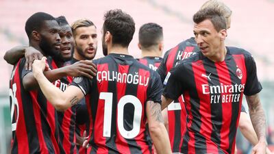 AC Milan players celebrate after Gianluca Scamacca's own goal. AP