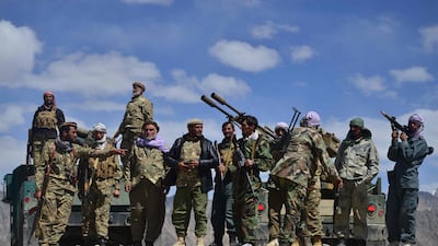 Afghan resistance fighters and anti-Taliban troops stand guard at an outpost in Kotal-e Anjuman, Panjshir province. AFP