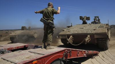 Israeli soldiers manuever a tank during a military exercise in the northern part of the Israeli-annexed Golan Heights. AFP