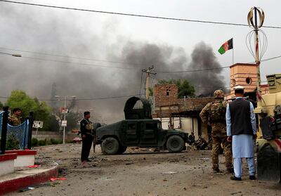 Afghan security forces keep watch during blasts and gun battle at the site in Jalalabad city, Afghanistan, on May 13. Reuters