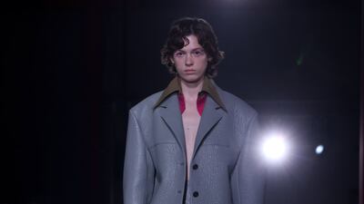 A sculpted jacket and skirt in uniform grey at Prada. EPA