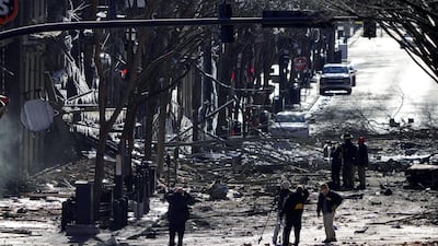Investigators work near the site of an explosion on 2nd Avenue that occurred the day before in Nashville, Tennessee, U.S. REUTERS
