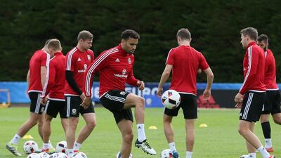 Wales' Hal Robson-Kanu, foreground, plays with the ball during a training session in Dinard, France, Monday, July 4, 2016. Wales will face Portugal in a Euro 2016 semifinal match at the Grand Stade in Decines-Charpieu, near Lyon, France, Wednesday, July 6, 2016. (AP Photo/Vincent Michel)